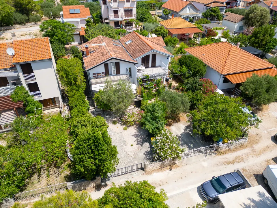 Aerial view of the quiet lane in Jadrija with the house and its garden in the centre